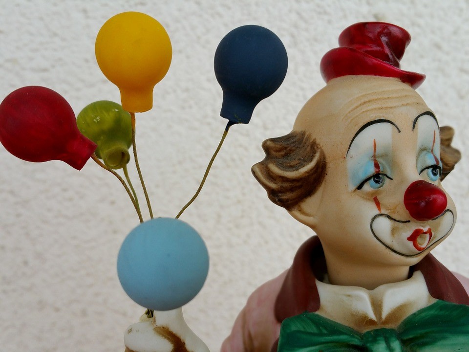 Clown figurine with balloons.