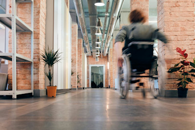 Woman using a wheelchair in the office settings