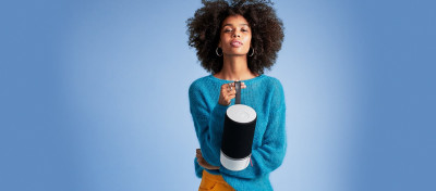 Woman with an audio speaker.