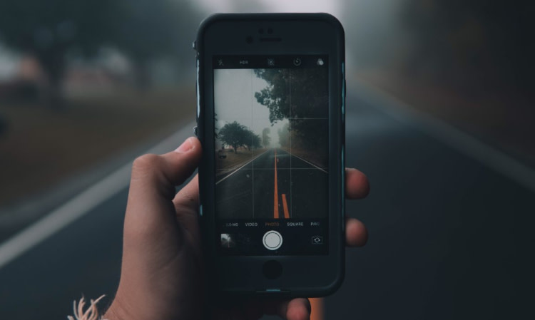 Taking a picture of the road with a phone camera. 