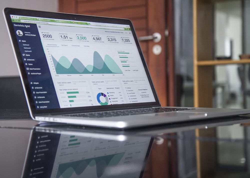 Analyst reviewing data on a laptop