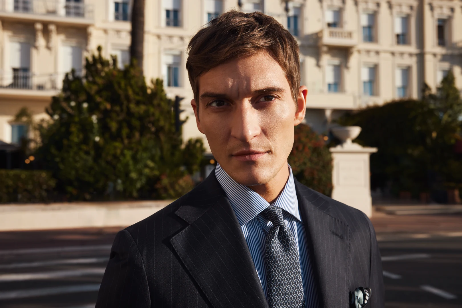 model in striped shirt suit and tie