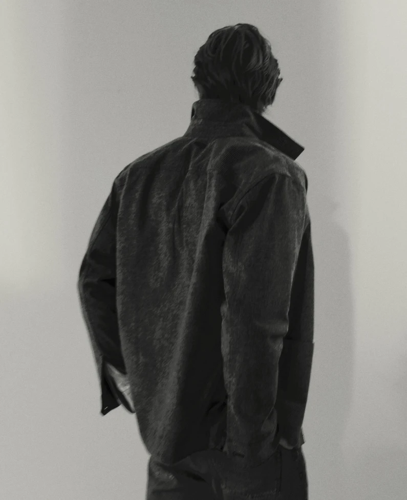 a man posing in a overshirt from behind