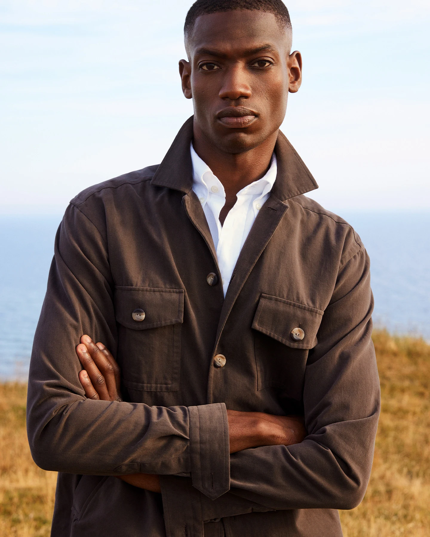 model close up white shirt and brown overshirt