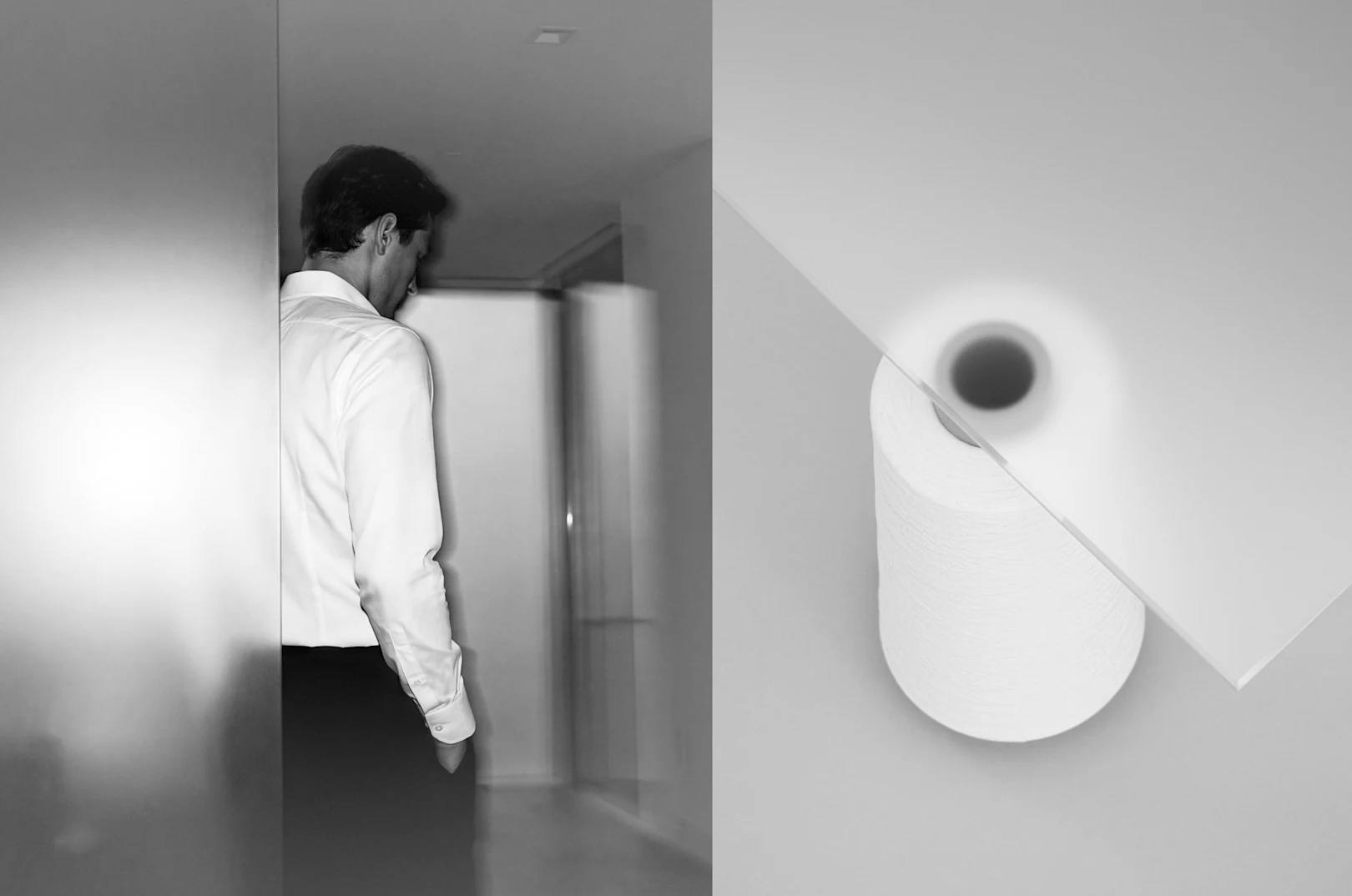 a man standing behind a glass wall