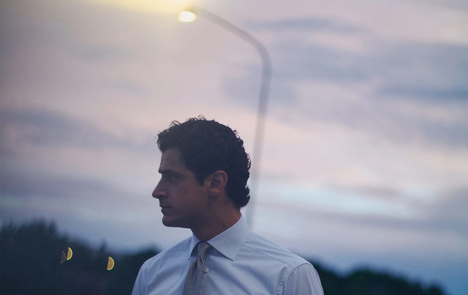 a man posing in the evening