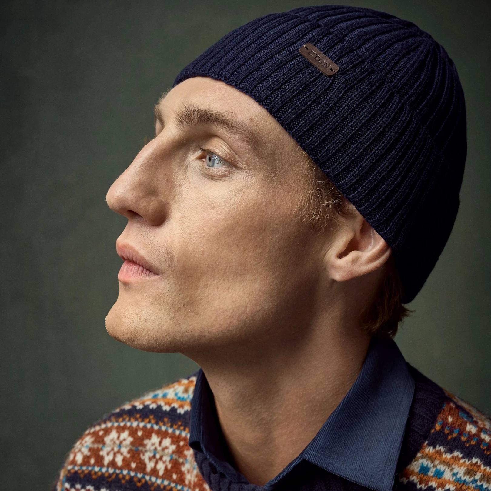 model in knitted sweater and beanie