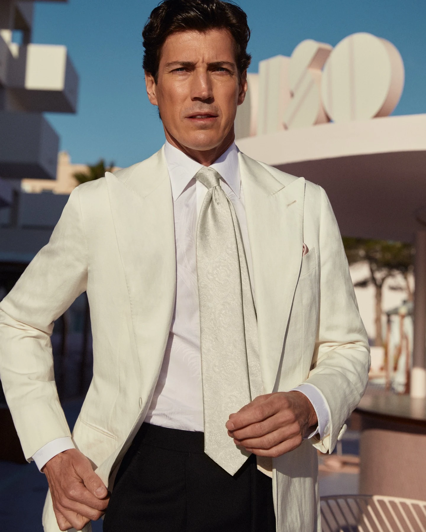 model in white tuxedo and shirt