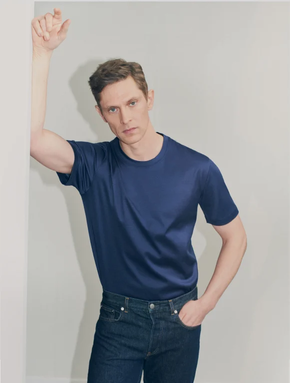 model posing in a navy filo di scozia t-shirt