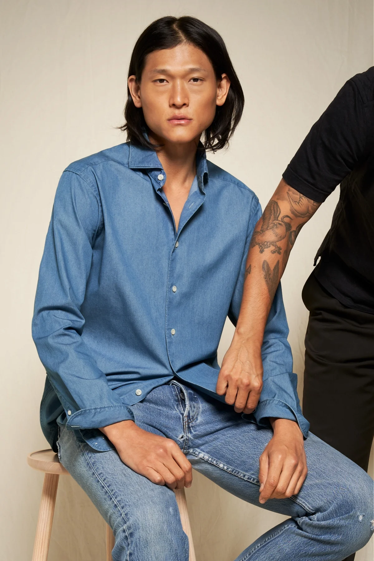 denim shirt on sitting model