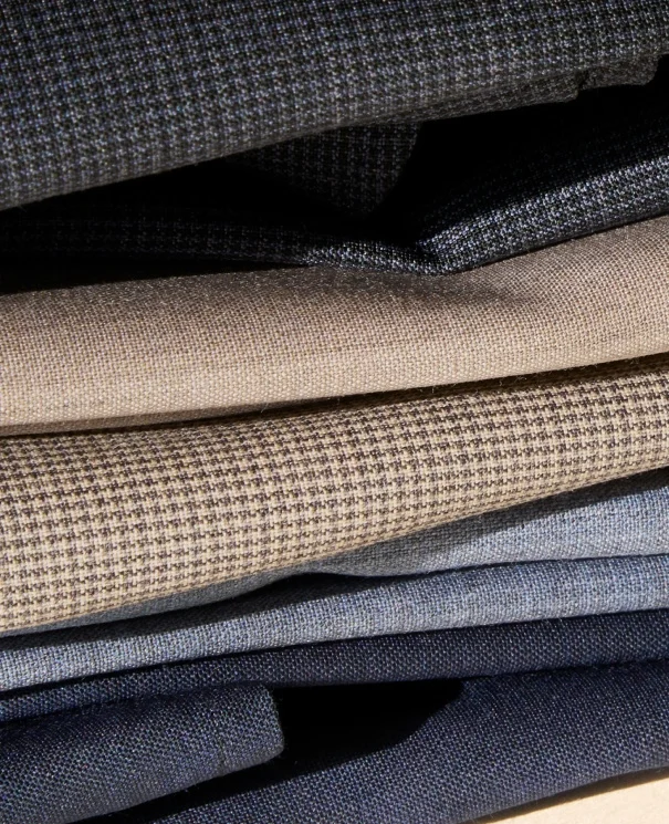 pile of merino shirts on a table