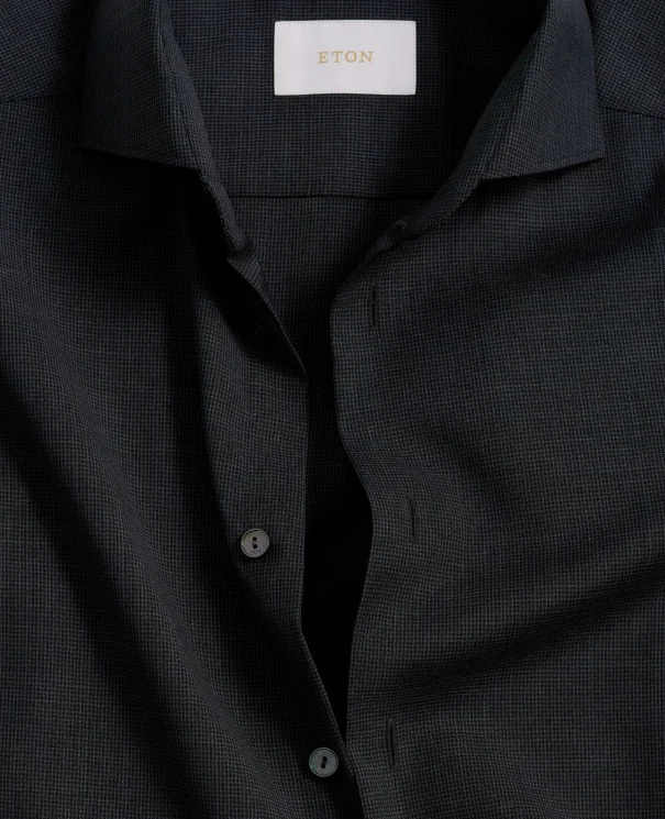 close up of a navy merino shirt