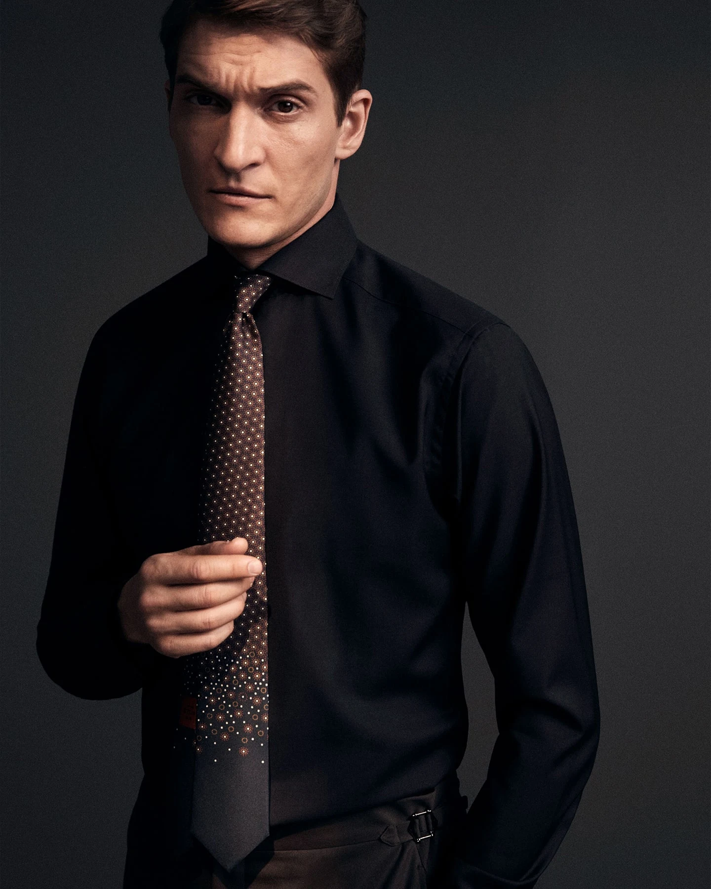 Dark shirt with a tie