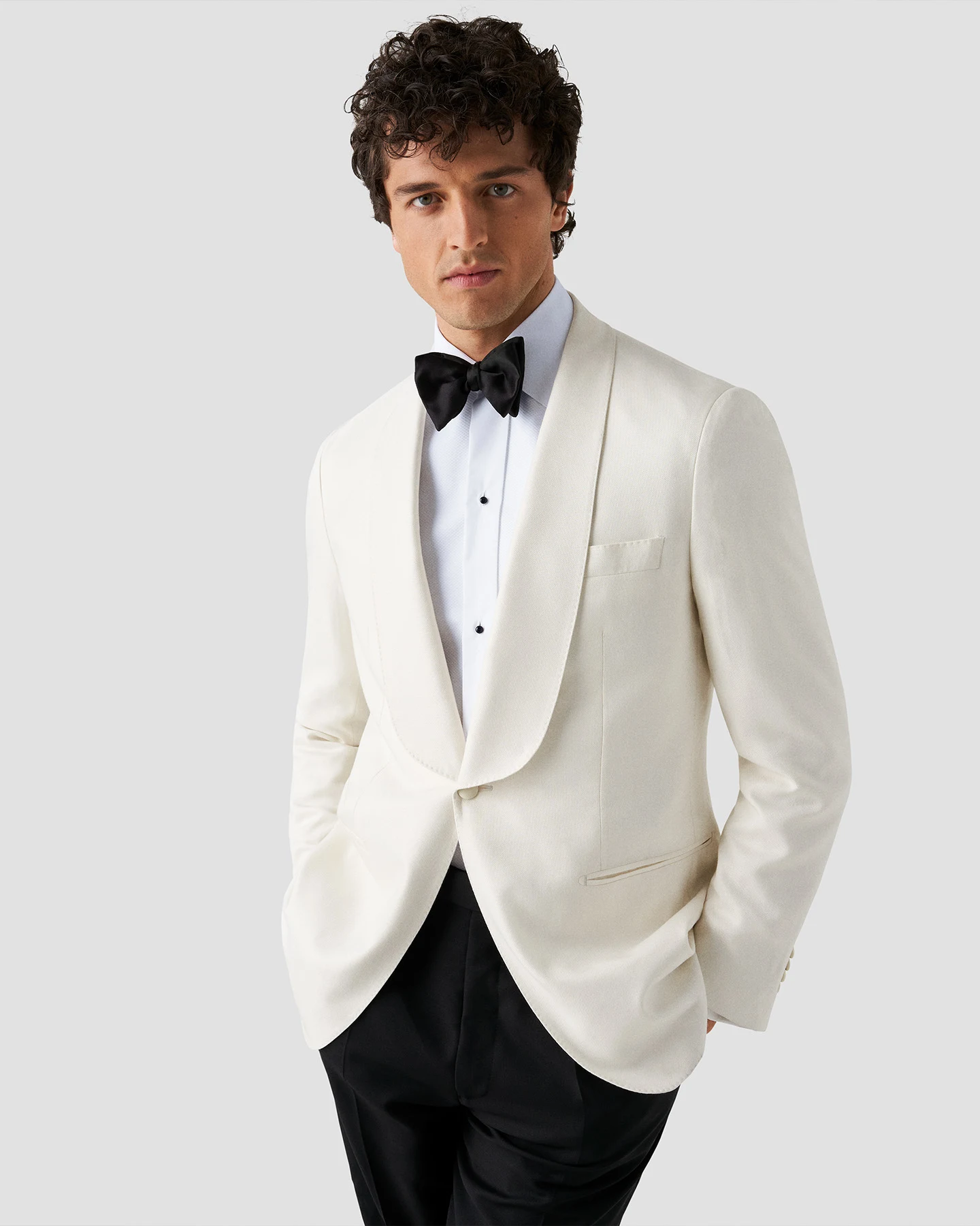 model in white tuxedo and shirt