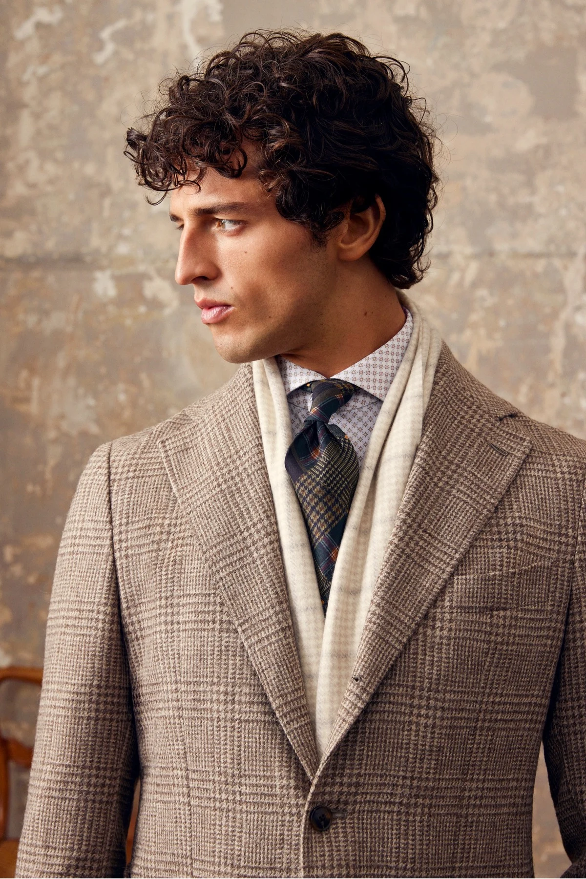 model styled with tie and warm scarf