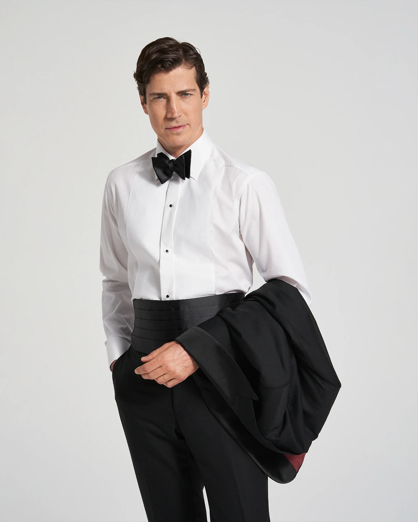 model in black tie with shirt and bowtie