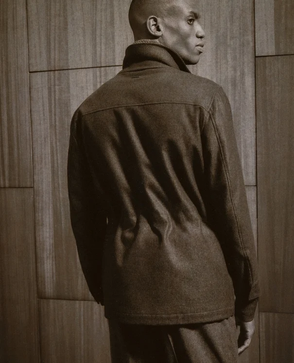 a model wearing a wool cashmere dream travel jacket showing the back