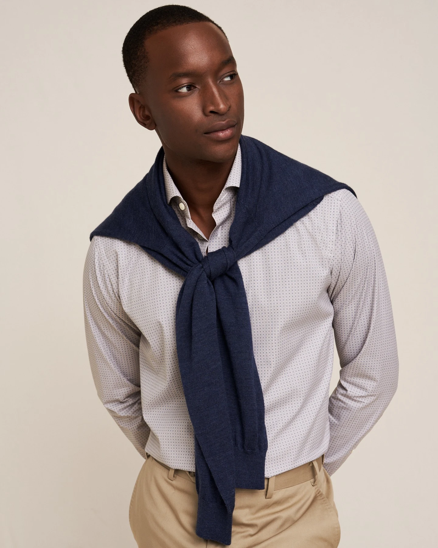 model in eton archive shirt and knit sweater over shoulders