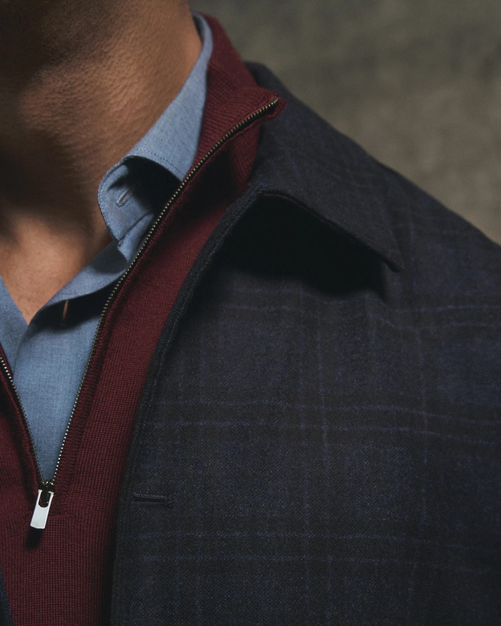 layered style with flaneel shirt, overshirt and burgundy sweater