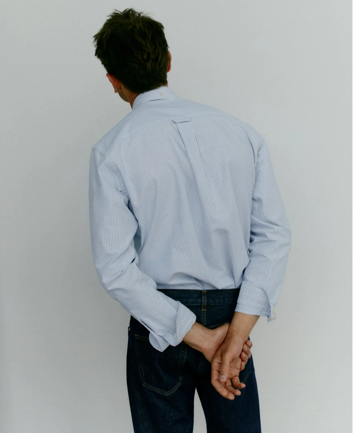 a man posing with his hands together in eton oxford