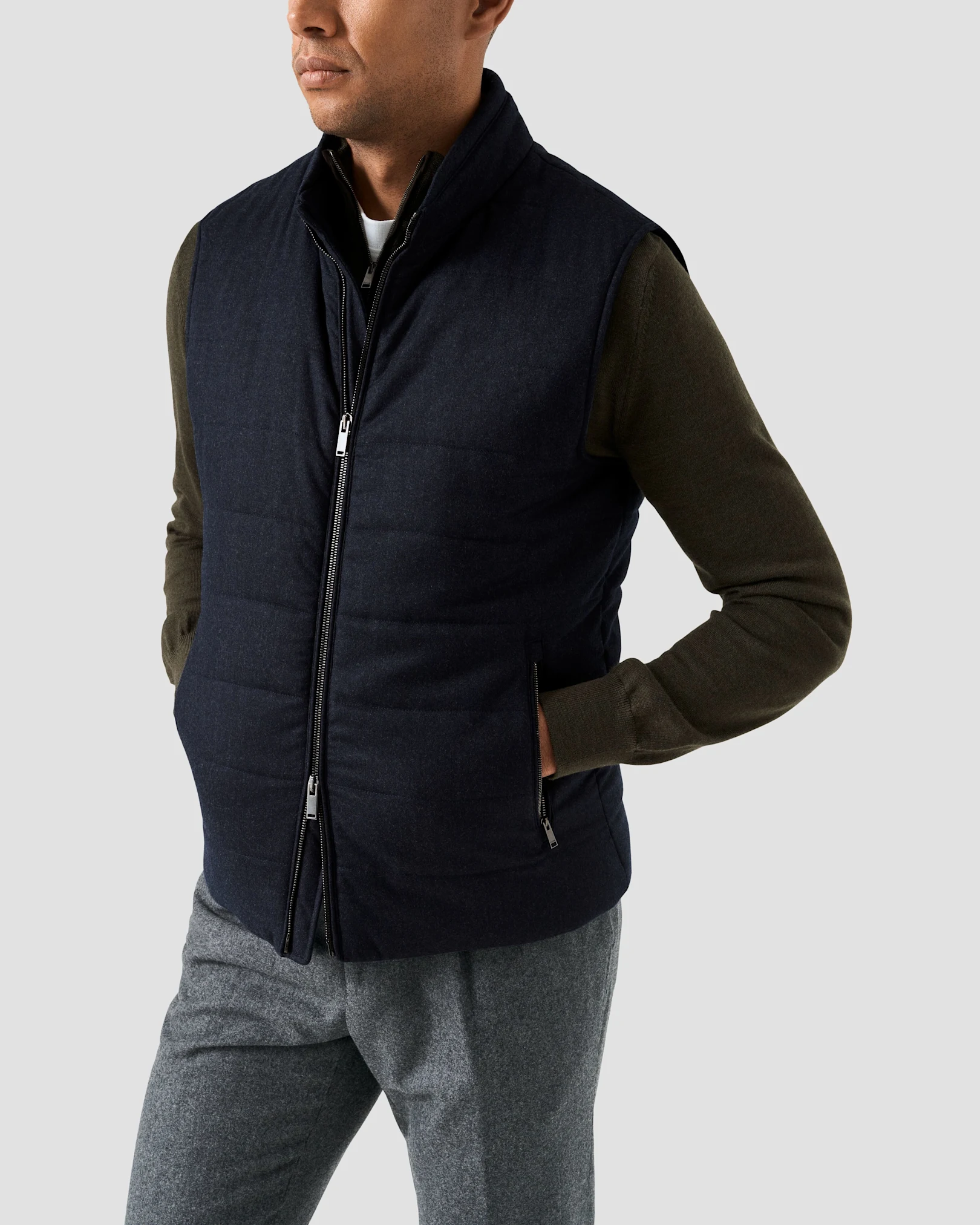Green halp zip sweater with navy padded vest