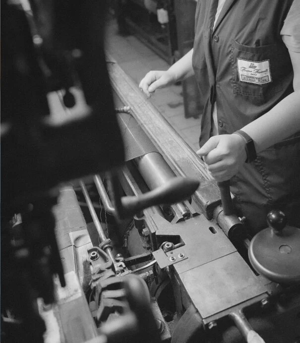 a woman using a weave machine