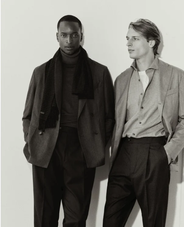 two models in black and white posing in eton shirts and soft jackets