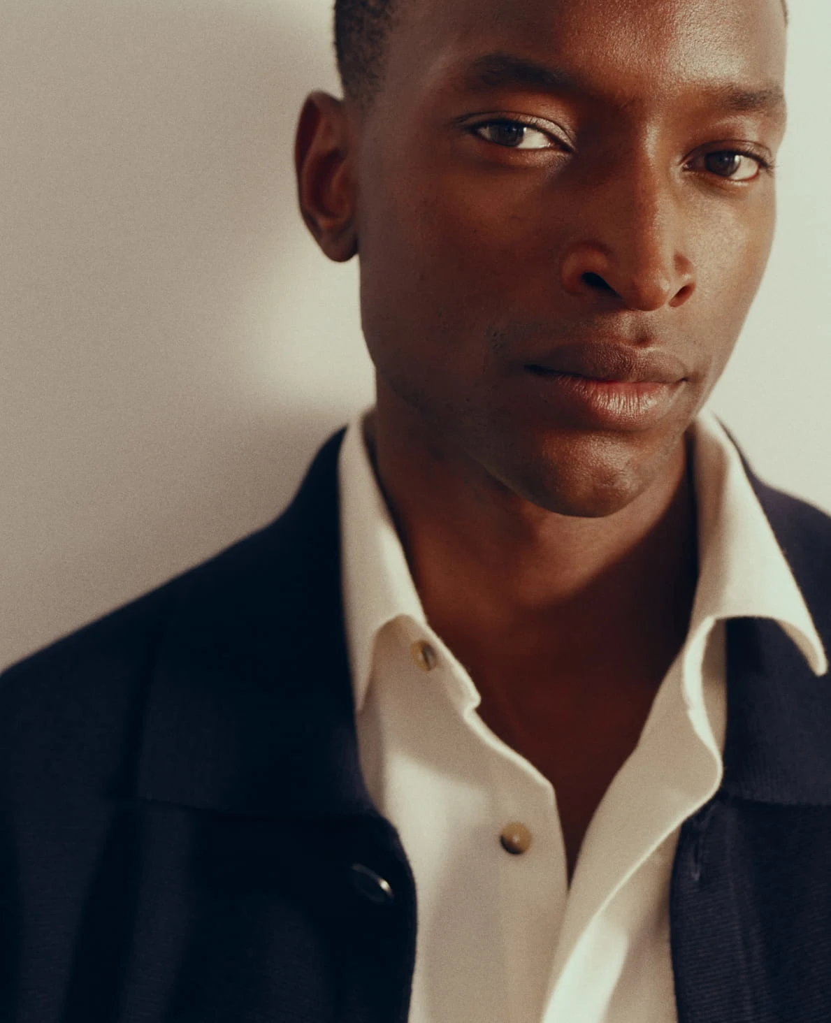 campaign image of a model in a overshirt and dress shirt