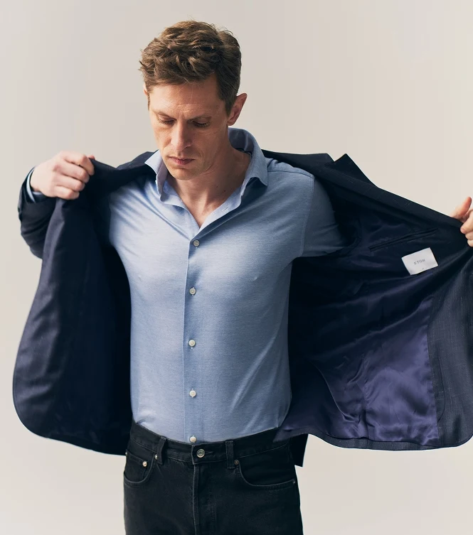 man putting on a soft jacket