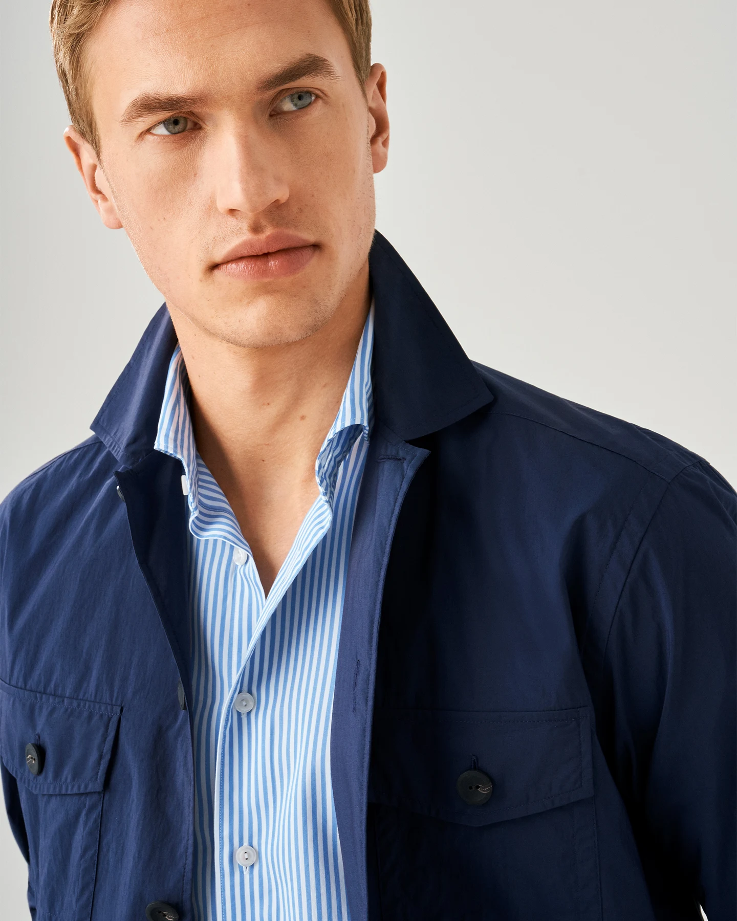 model in striped shirt and overshirt