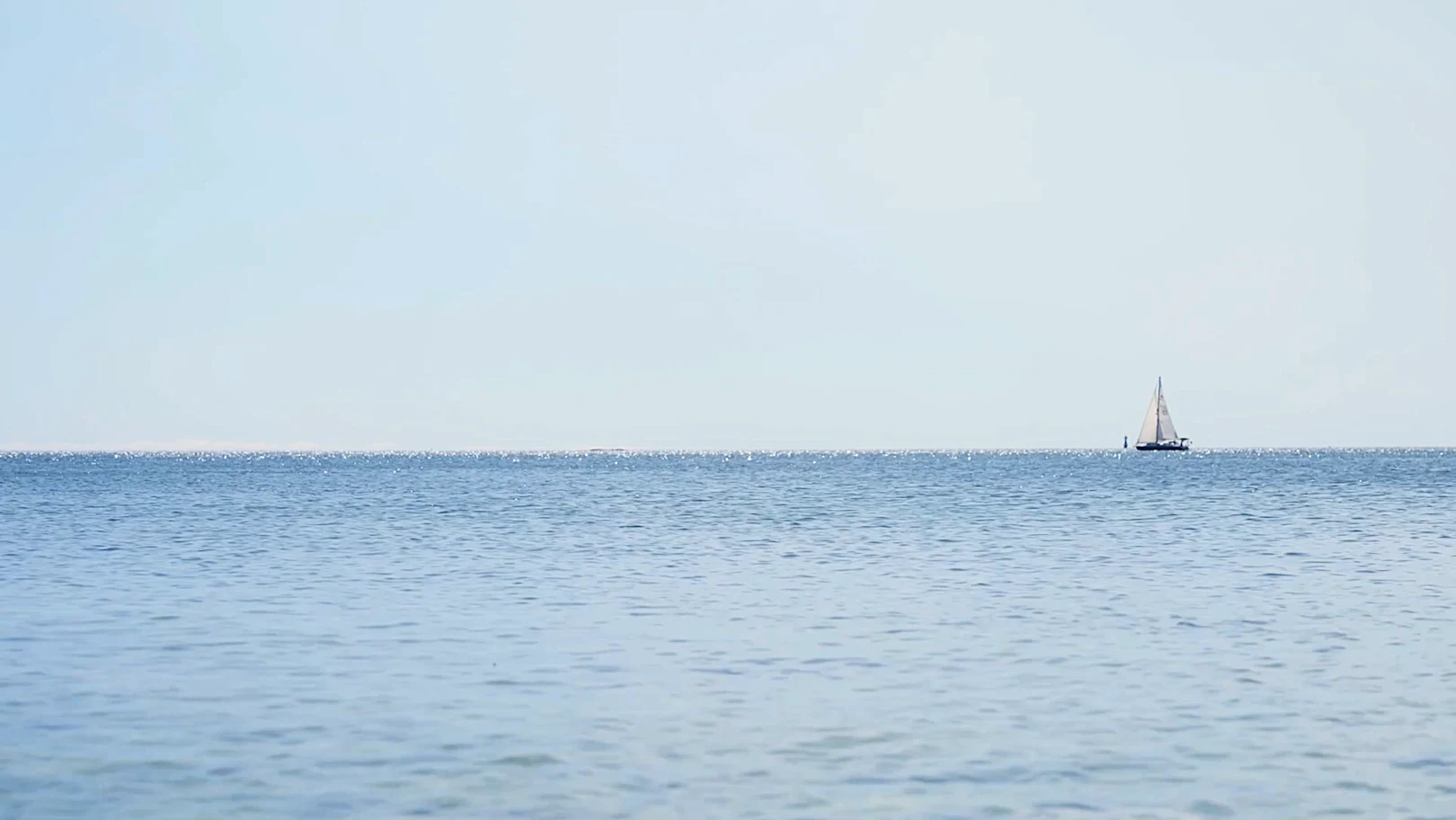 video of a sail boat in the horizon