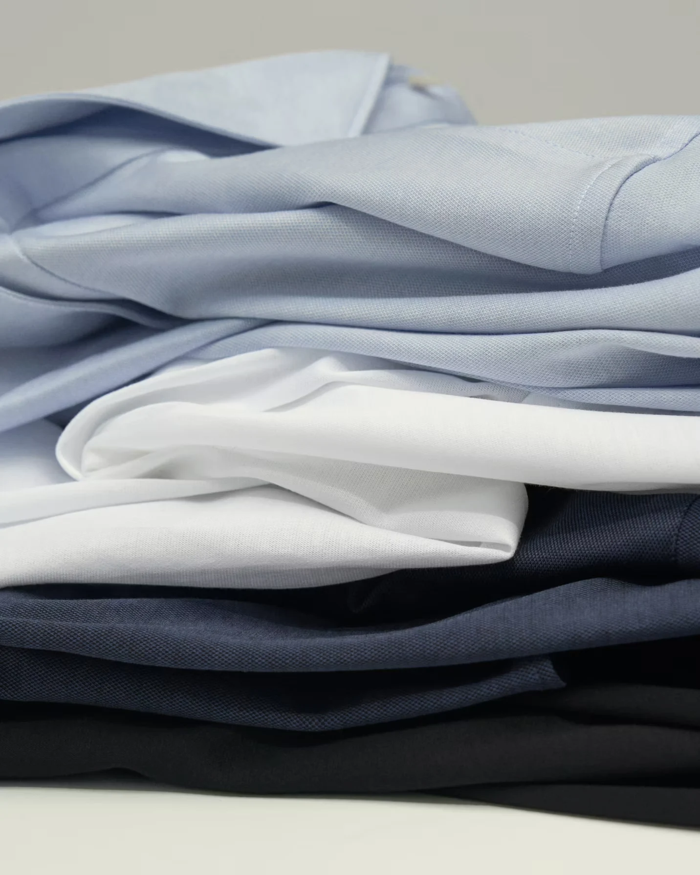 pile of filo shirts in studio