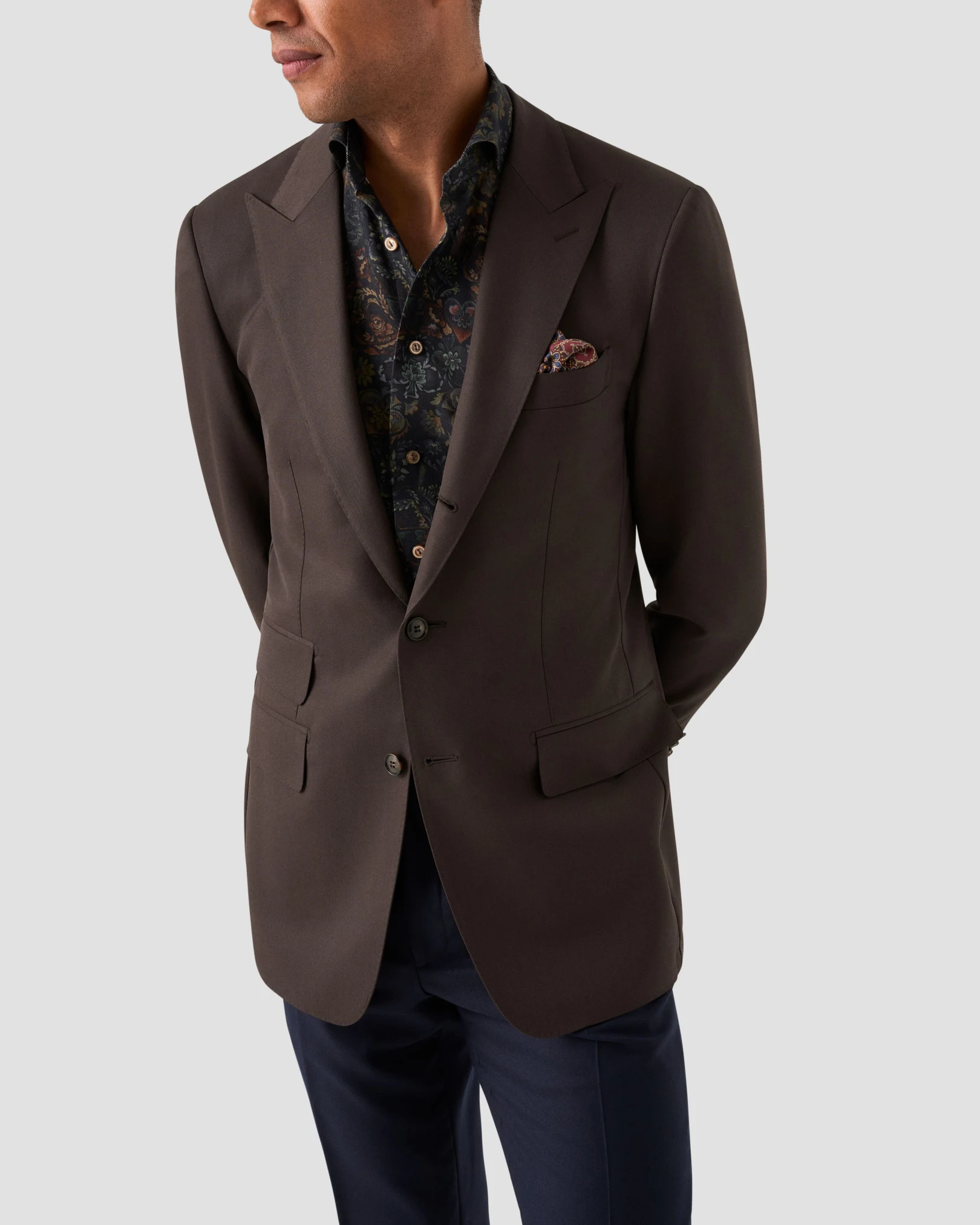 darker dressed model in shirt and suit