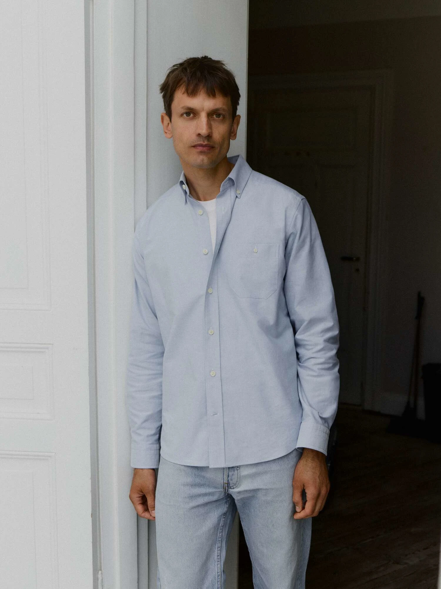 a man in an oxford shirt