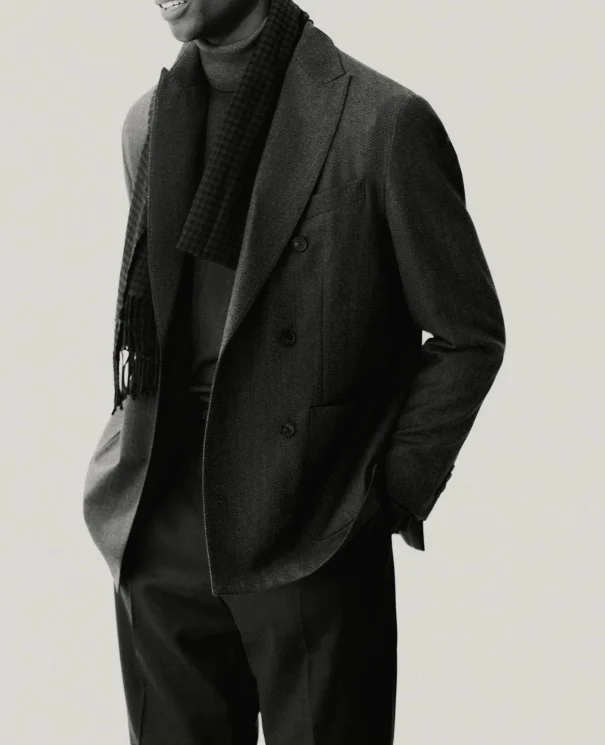 a man posing in a double breasted soft jacket
