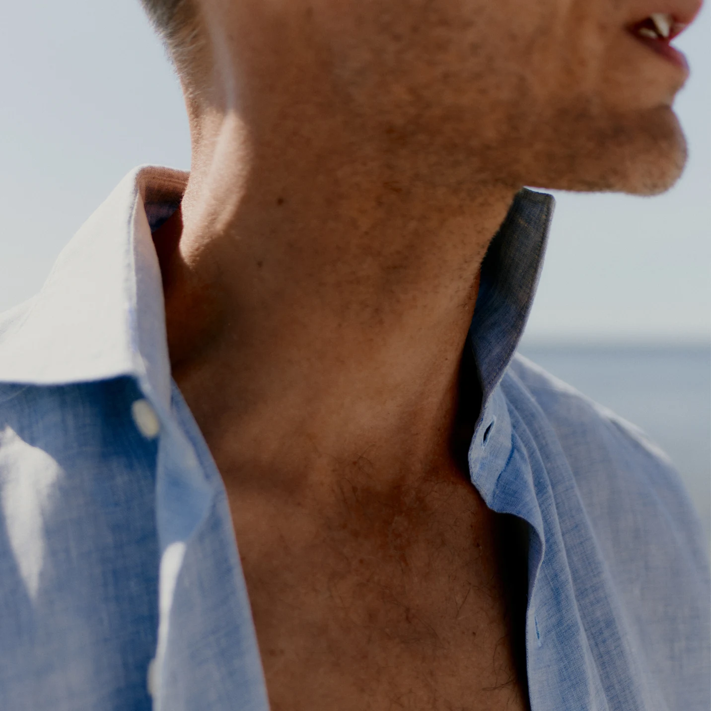 model in white linen shirt