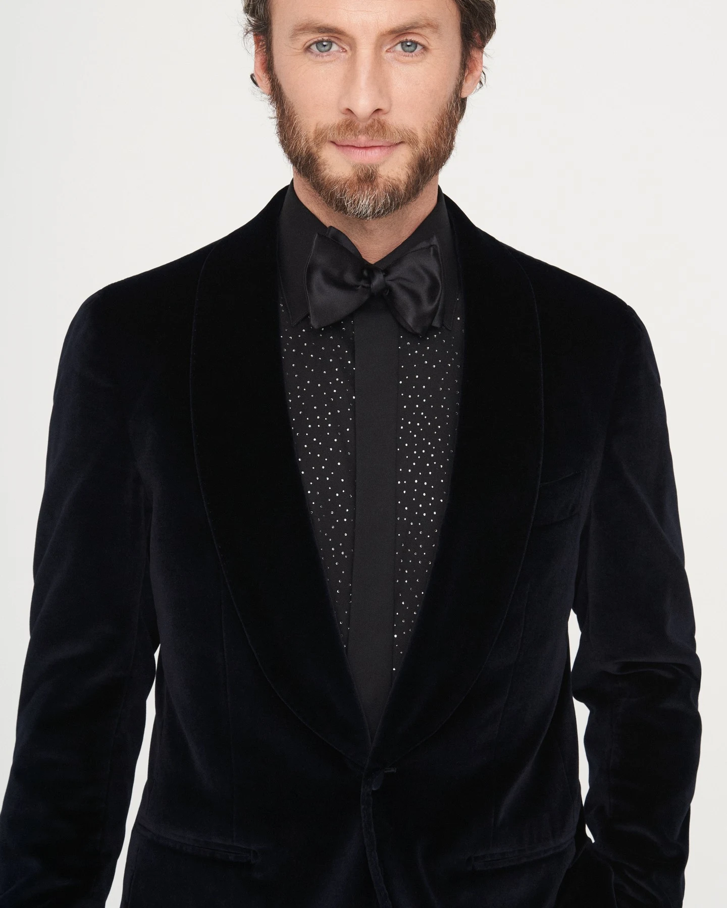 model in black tuxedo and black swarowski shirt