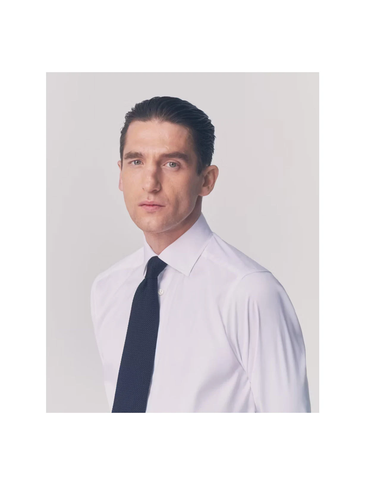 a man posing wearing a white signature twill shirt