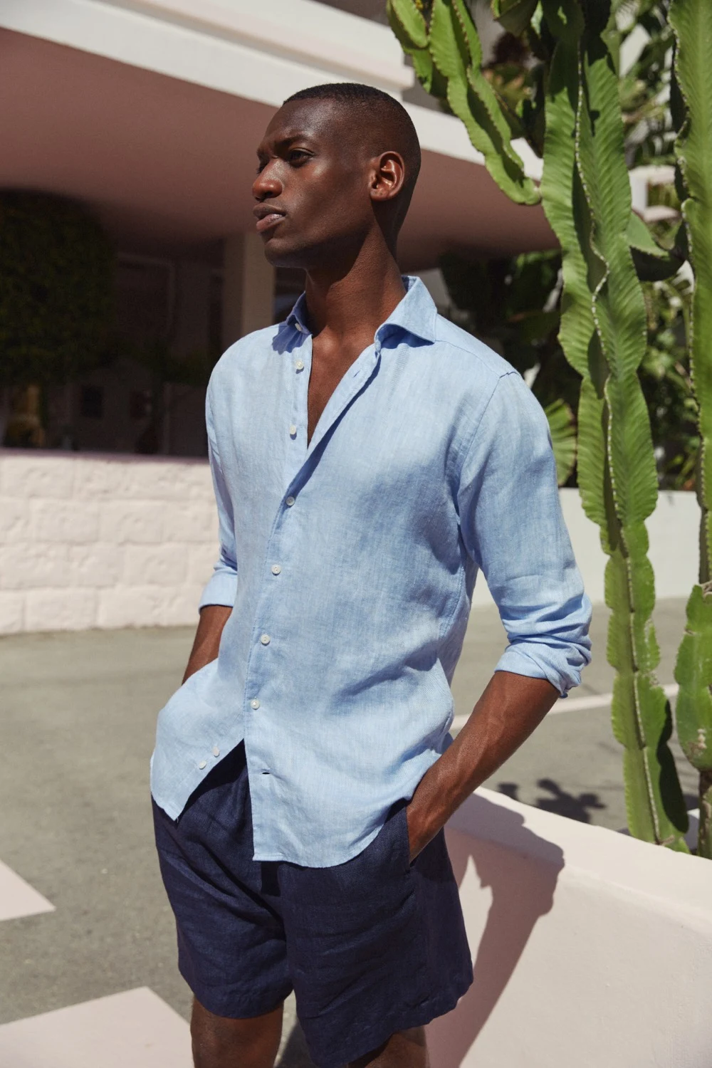 model in blue linen shirt