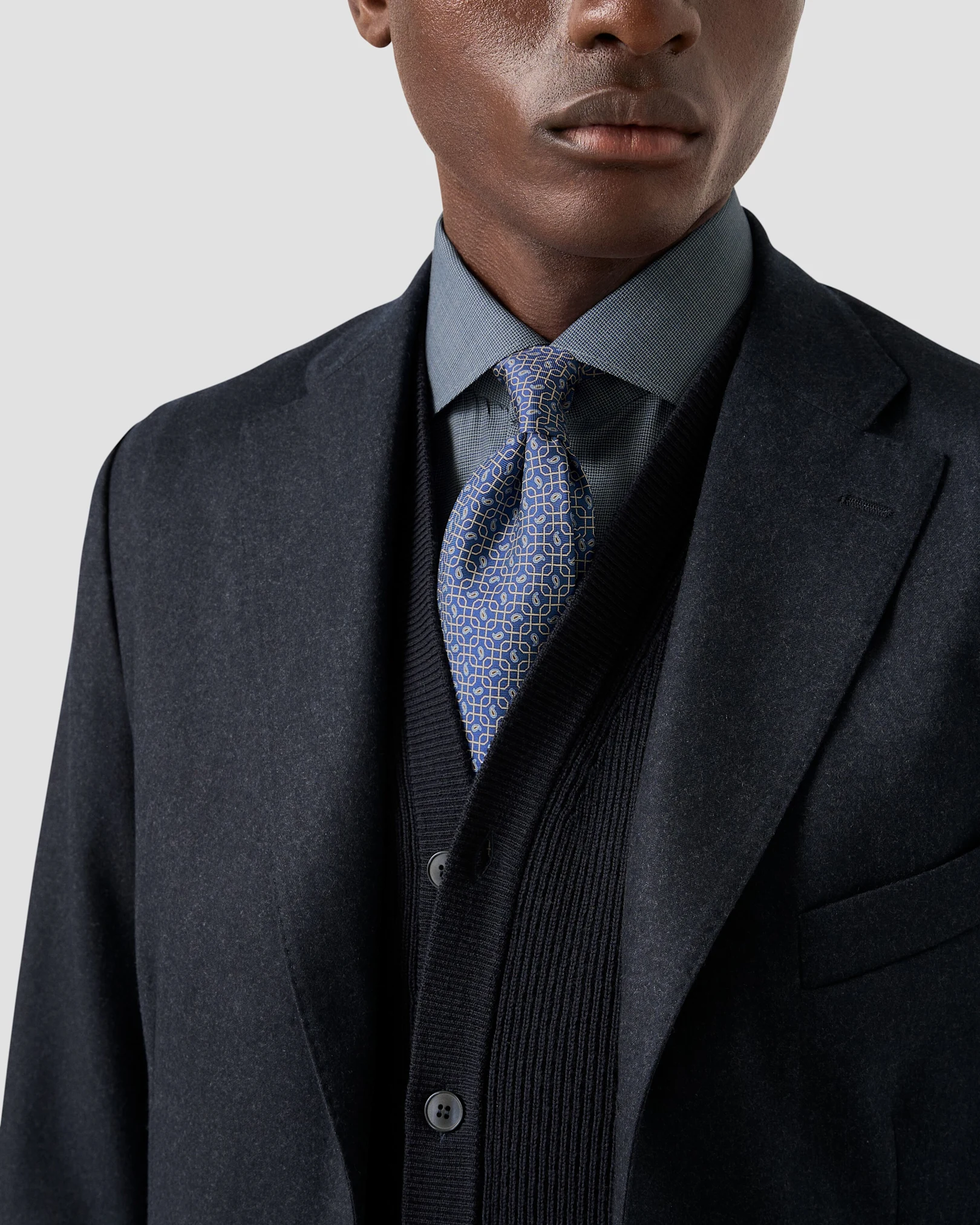 Navy knitted vest with soft jacket and tie