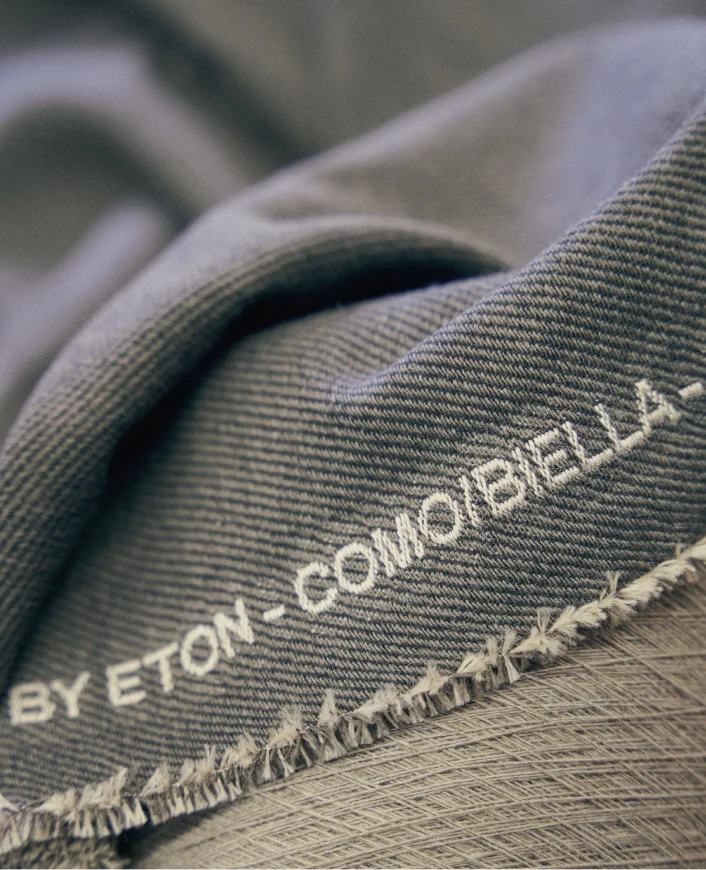 a close up of the finished wool cashmere dream fabric with the text "by eton - como/biella -"