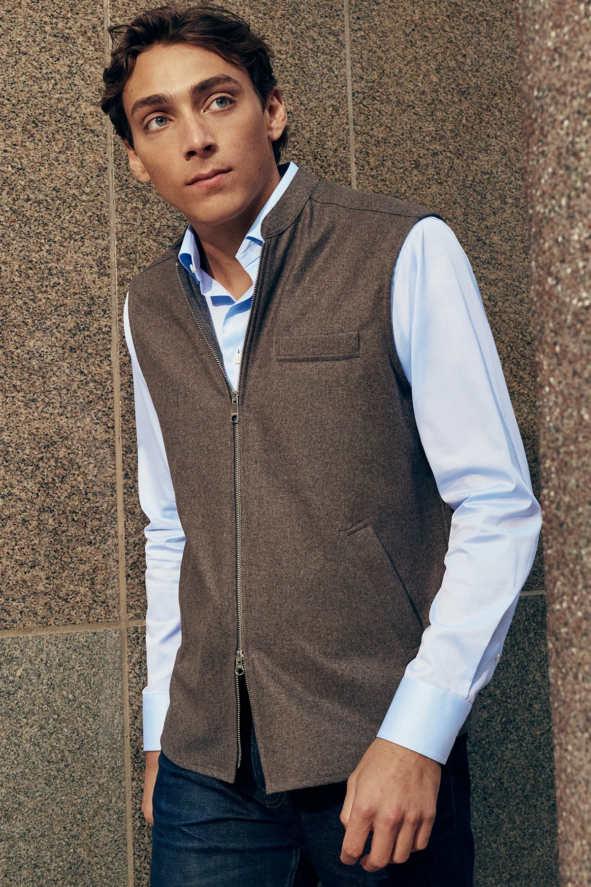New arrivals. Model wear a wool vest and a blue shirt