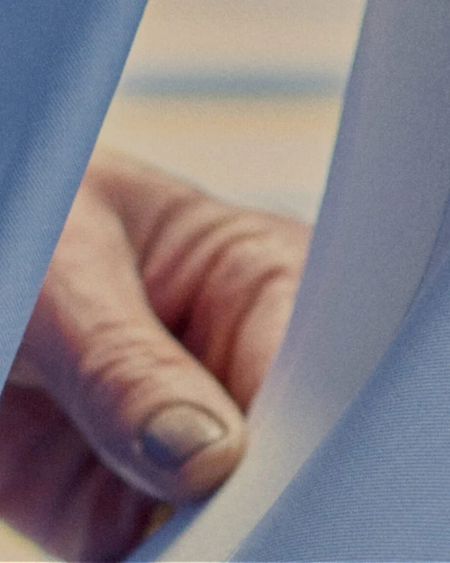 a hand pulling fabric
