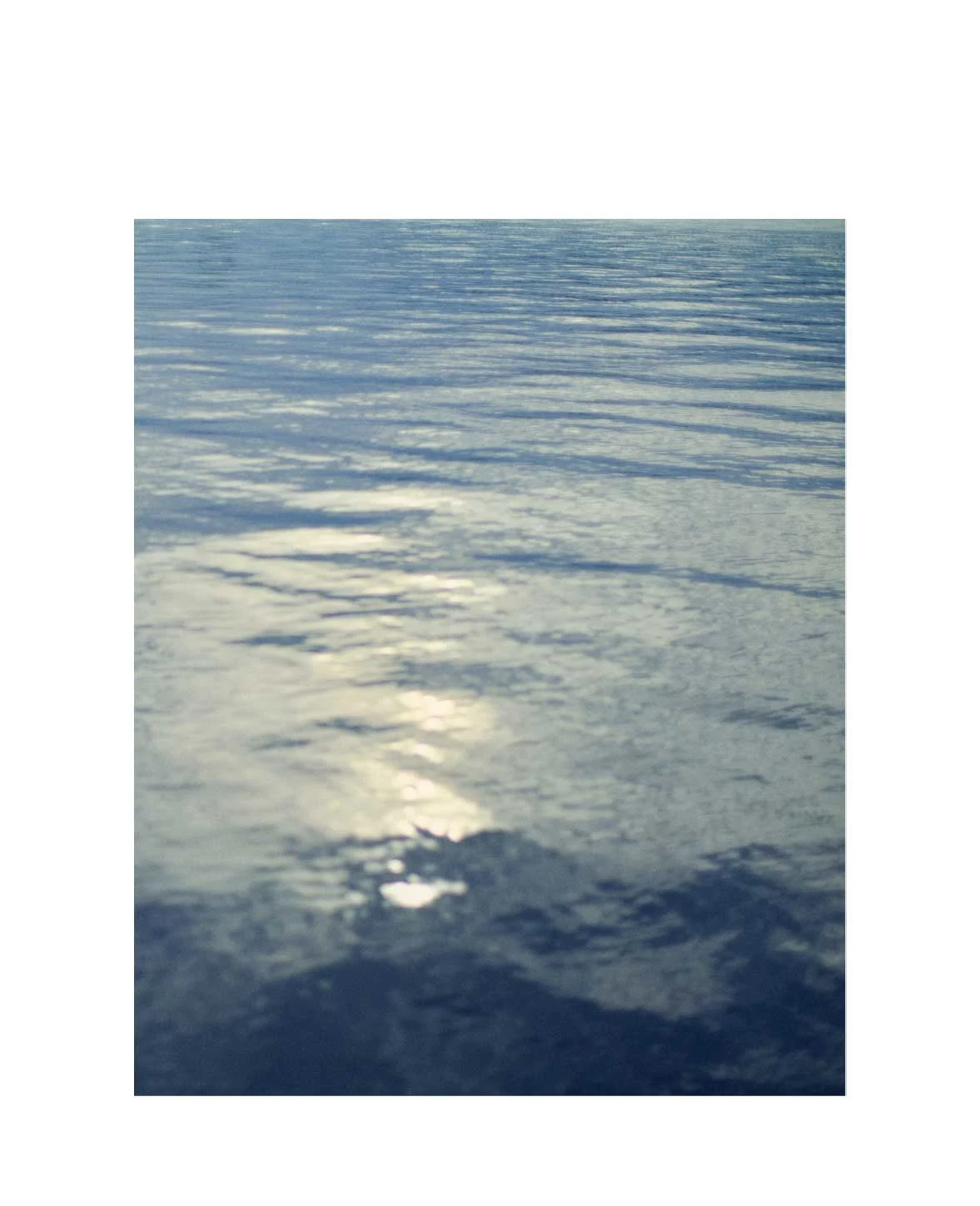 a close up shot of a still ocean water