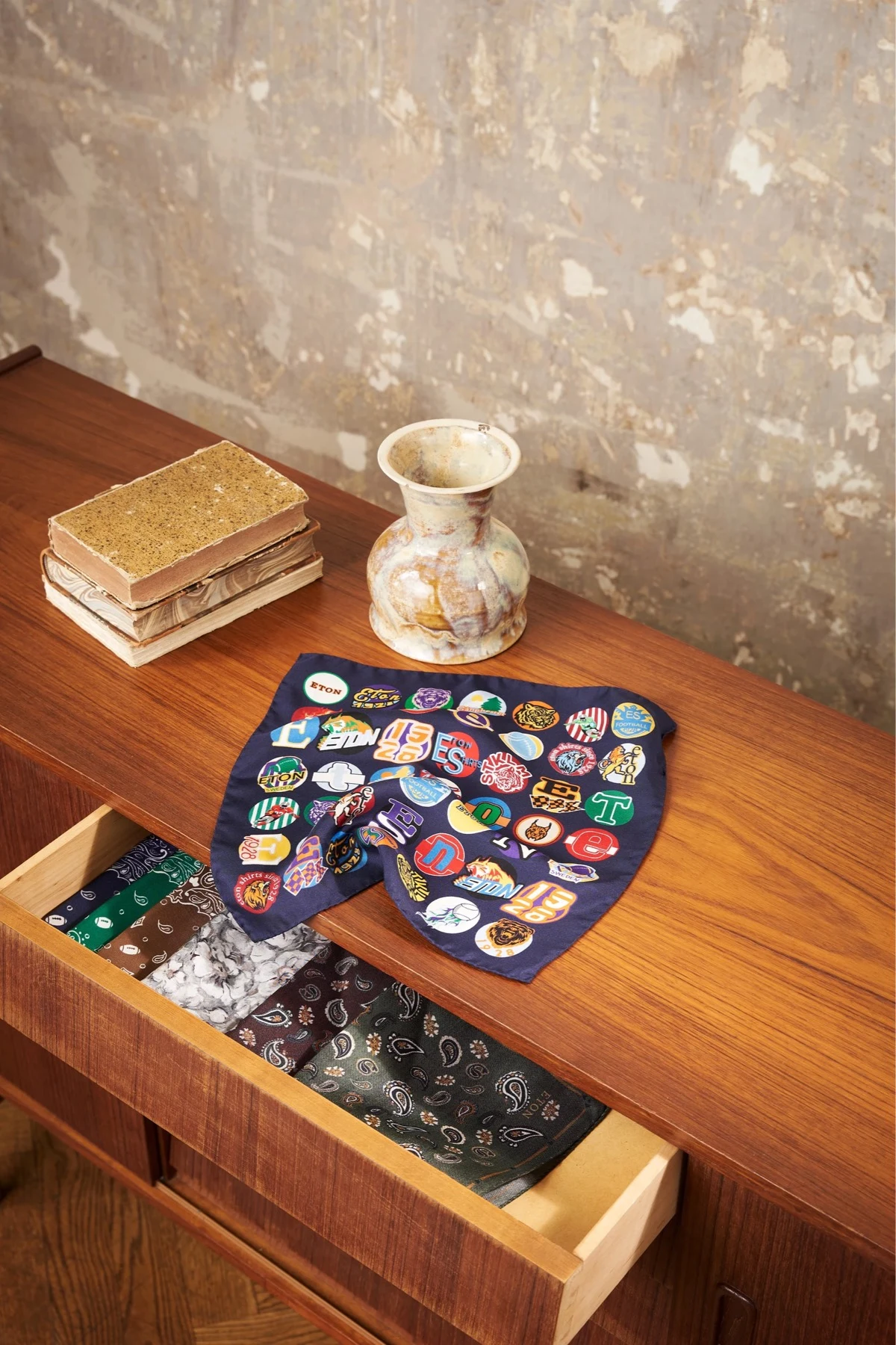 pocket square on cabinet with box open with range of pocket squares