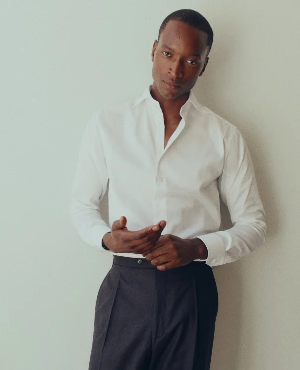 a model posing in a white signature twill shirt from eton