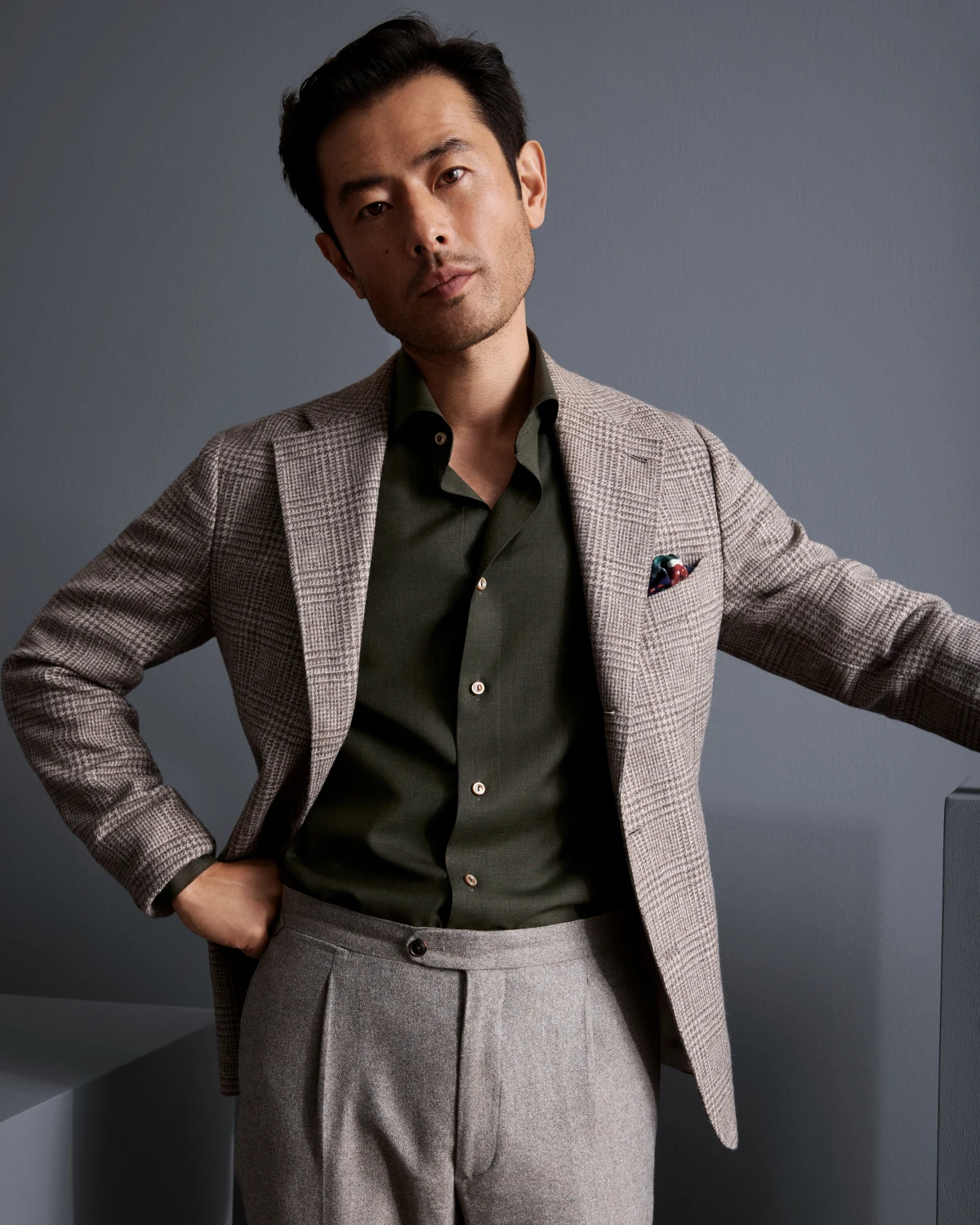 model in green merino wool shirt and suit