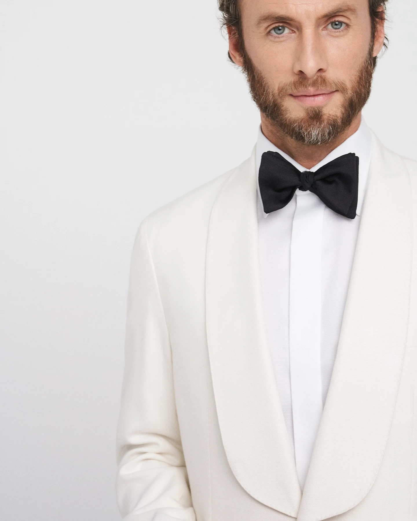 model in white dinner jacket