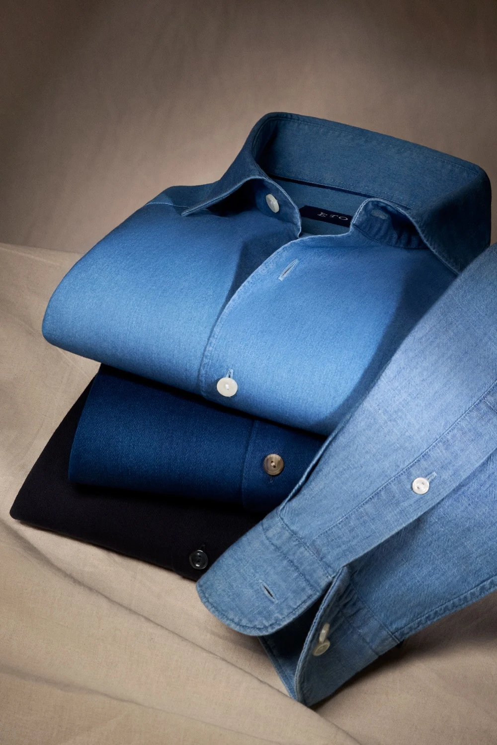 denim shirts laying pile