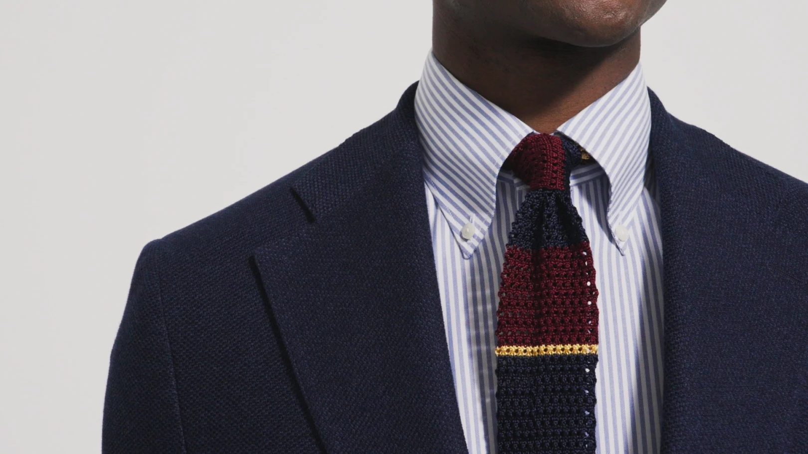 model with striped grenadine tie